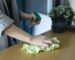 a person cleaning the table with cleaning cloth